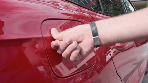 Charging an Electric Vehicle on a Sunny Day