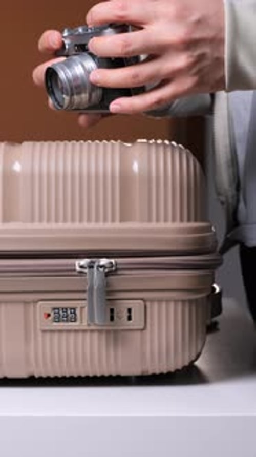 Packing for a Trip: Camera and Suitcase Preparation