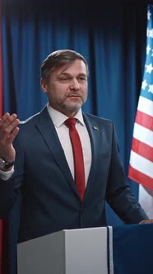 Man Giving a Speech at a Podium