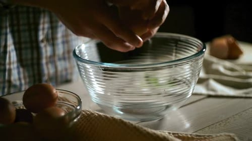 Man Hand Breaking Chicken Egg. Chef Breaking Egg. Close Up of Male