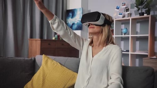 Woman Experiencing Virtual Reality Headset in Living Room