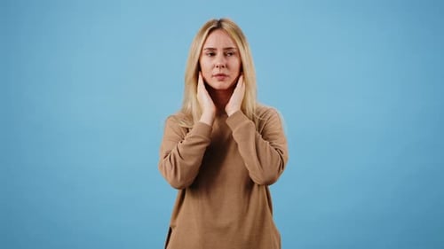 Woman With Headache and Pain Touching Temples