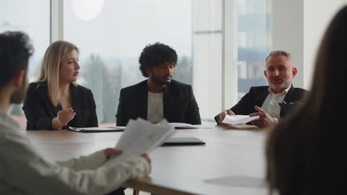 Colleagues Collaborate During Corporate Meeting