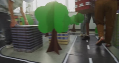 Children Play in Cardboard City Construction