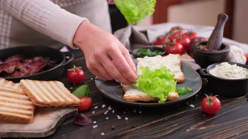 Close Up of Preparing a Sandwich With Bacon