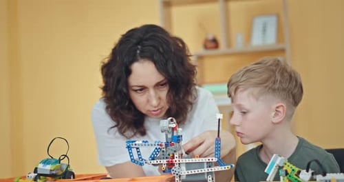 Be Technology Literate Diverse Children Assembling and Programming Robots During STEM Class with
