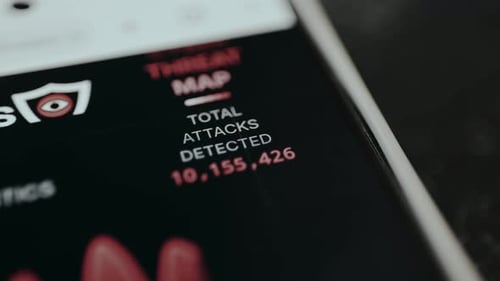 Total Attacks Detected Cybersecurity Threat Map on Phone Screen