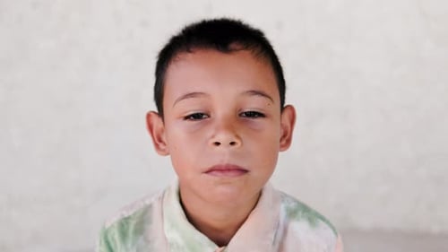 Latin child kid looking at camera, Childhood and diverse community concept