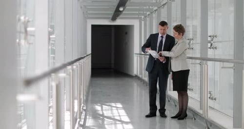 Business people having meeting in modern office using digital tablet