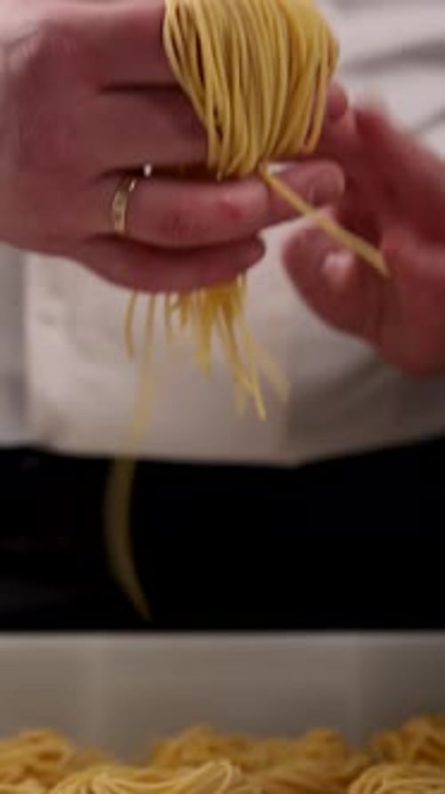 Chef Forms Fresh Spaghetti Noodles