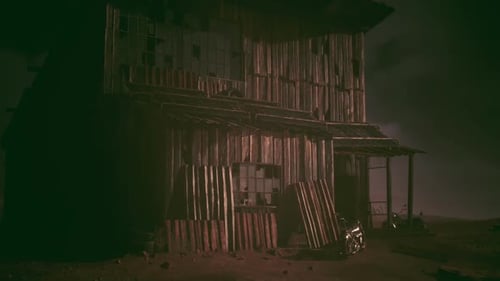 Abandoned Wooden Building Surrounded By Desolate Landscape at Night