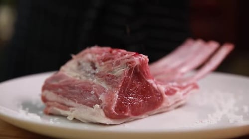 the chef prepares delicious meat in the restaurant