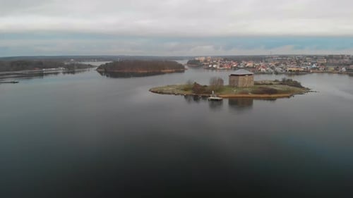 Aerial footage of Kruthuset a historical old building located in the ocean at Karlskrona, Sweden. I