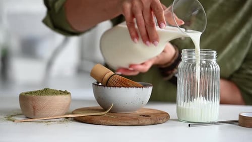 Adult Preparing Matcha Latte in Bright Kitchen