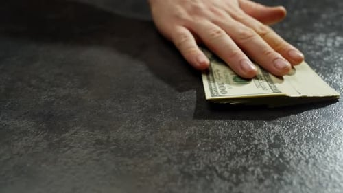 There are Currency Notes on the Table Indicating Financial Relations