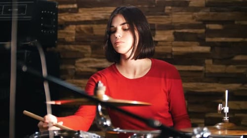 Repetition Girl Actively Plays the Drums