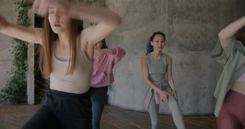 Young Women Exercising in Dance Studio
