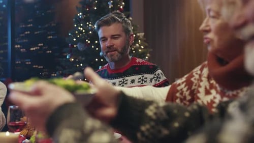 Family Celebrates Christmas with Dinner and a Toast
