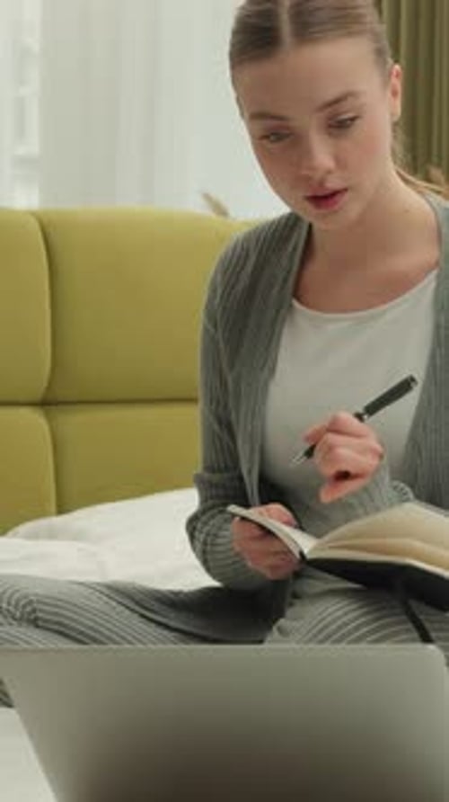 Caucasian Woman Using Laptop Technology Writing Notes Information at Bedroom Remote Elearning