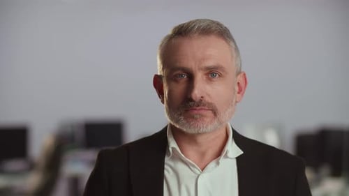 Serious Man in Suit Close-Up in Office