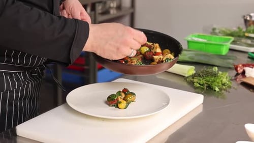 The chef prepares chicken in the kitchen. delicious lunch menu idea for a hotel grande cuisine