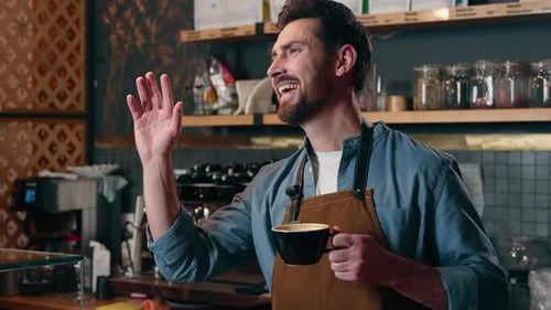 Cheerful Happy Caucasian Waiter Cafe Worker Barista Small Business Owner Holding Cup of Coffee