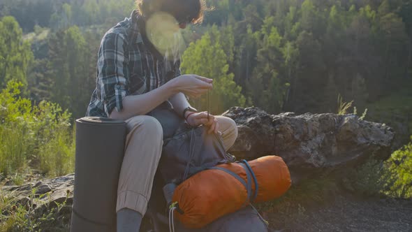 Hiker Preparing Backpack in a Forest Setting, Nature Stock Footage ft ...