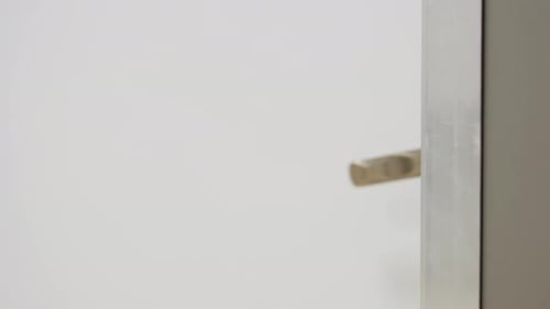 Door Handle Close Up With Door Closing Indoors