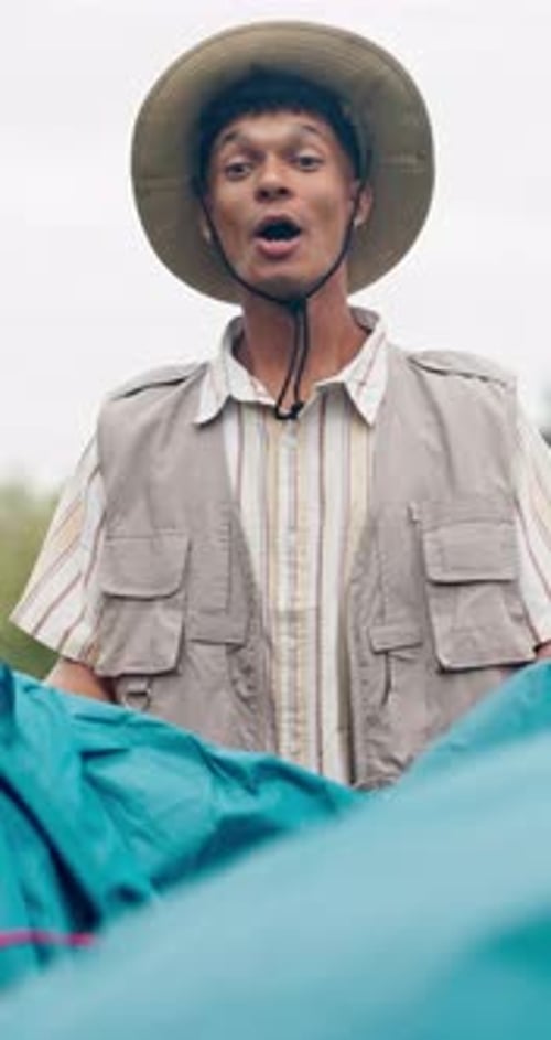 Young Man Smiles Wearing Explorer Outfit Outdoors