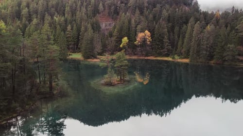 Moody Aerial Video of Fernsteinsee Lake in Austria in Autumn Season