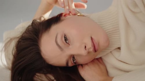 Woman Posing Indoors with Soft Lighting