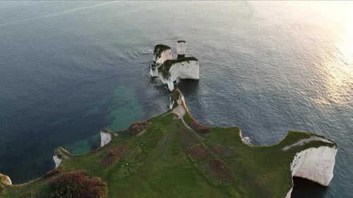 Sunrise at Old Harry Rocks near Studland, Dorset, aerial view.