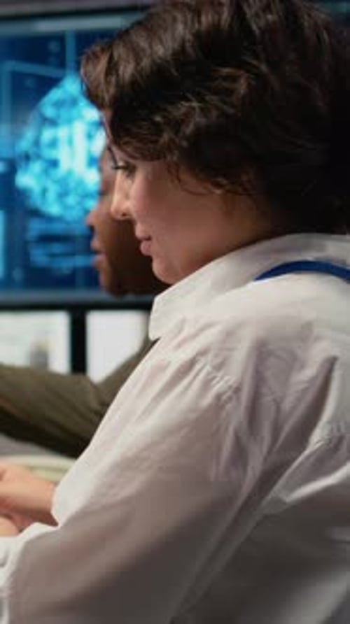 Vertical Video Software Developers in Startup Office Brainstorming Leveraging AI Tech