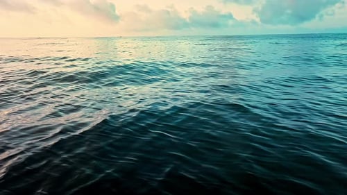 Aerial Top view of a transparent blue sea with beautiful waves at sunny day in summer. air of ocea