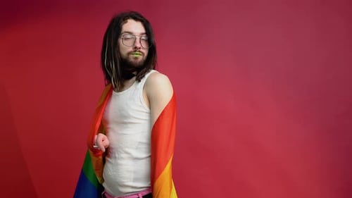 Young Adult Posing with a Pride Flag