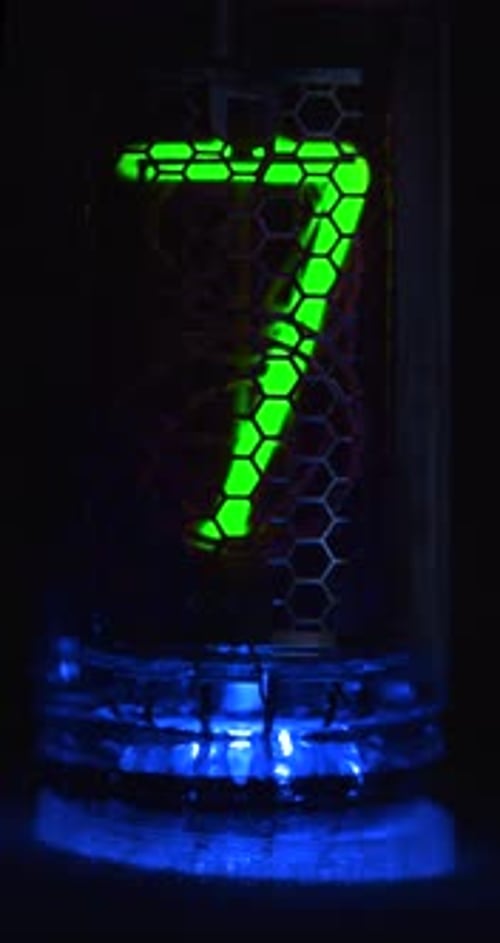 A Retro Tube Timer on a Glowing Acid Blue Base Counts Down 10 Seconds Vertical Footage