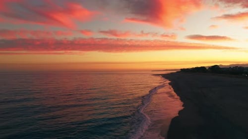Red Fired Sunset Clouds On Ocean