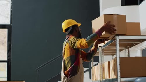 People Stocking and Moving Boxes in a Warehouse