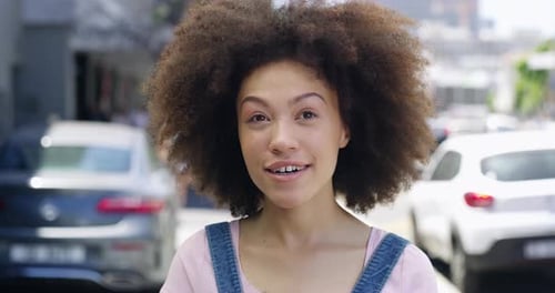 4k video footage of a young woman being interviewed about travel destinations on the street