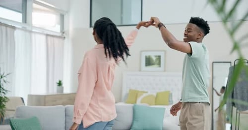 Happy Couple Dancing Together in Modern Home