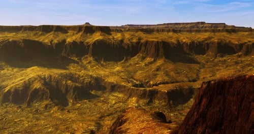 Breathtaking View of a Rugged Canyon Topography Under Bright Blue Sky