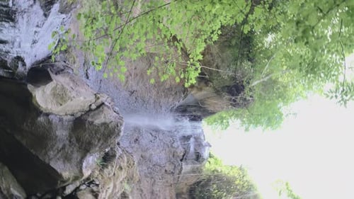 Vortex Shot Top of a wild Waterfall in a forest 4k 30fps.mp4