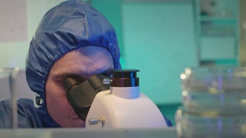 Scientist Using Microscope in Lab, Close Up