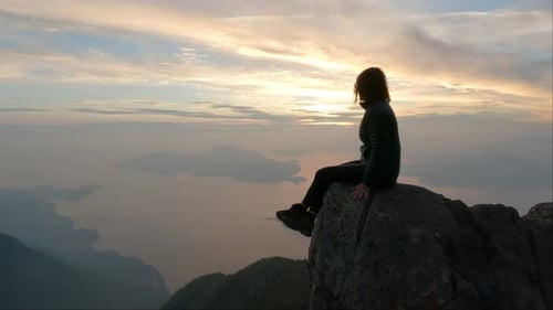 Adventurous Woman Hiker on Top of Canadian Mountain Landscape on the West Coast of Pacific Ocean