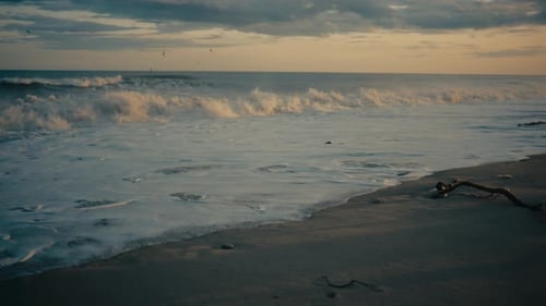 Foam Of The Gentle Waves Crashing On The Beach After The Storm