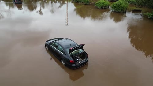 Car Flooded in Parking Lot After a Flood