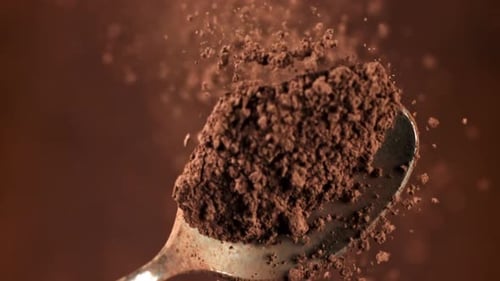 Cocoa Powder Falls From a Spoon Filmed on a Highspeed Camera at 1000 Fps