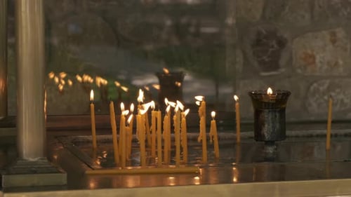 Lit Candles Glowing in the Dark