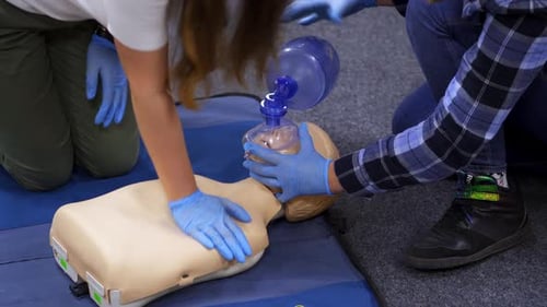 CPR Training with Gloves on Training Dummy