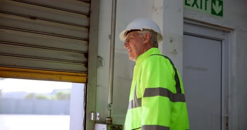 Construction worker, roller and man at garage door of warehouse with morning routine